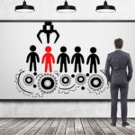 An image representing the hiring , with a man pointing out a selected candidate