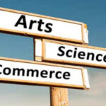 Direction board with arts ,science and commerce written in each direction.